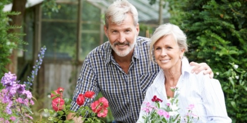 Man and woman enjoying the benefits of dental implants